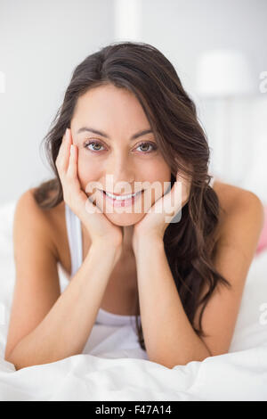 Portrait of smiling woman looking at camera Stock Photo