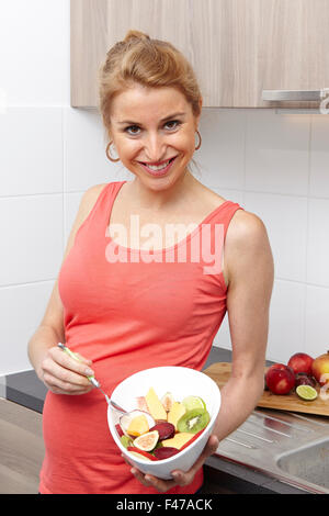 PREGNANT WOMAN EATING Stock Photo