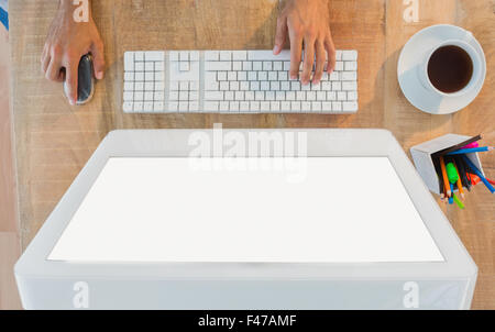 Hands typing on computer at desk Stock Photo