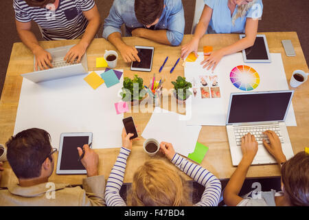 Creative colleagues with laptop and digital tablet Stock Photo