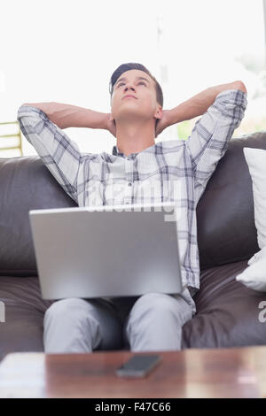 Young handsome man using a laptop Stock Photo