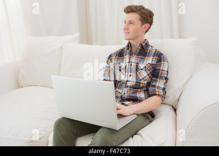 Handsome man using laptop computer Stock Photo