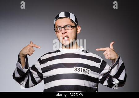 Funny prisoner isolated on gray Stock Photo