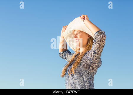 Pretty blonde wearing straw hat Stock Photo