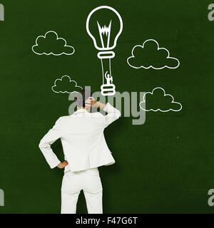 Composite image of thinking businesswoman Stock Photo