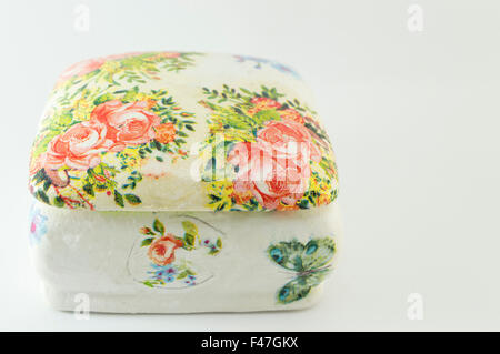 Decoupage decorated closed vintage jewelry box on white background Stock Photo