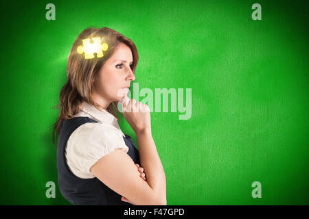 Composite image of thinking businesswoman Stock Photo