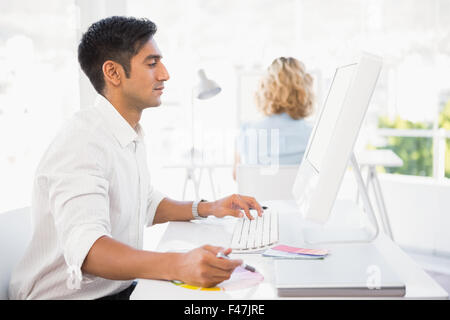 Young business people typing on the computer Stock Photo