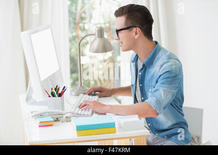 Happy handsome man using computer Stock Photo