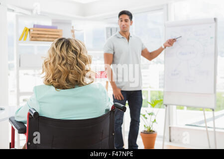 Young businesswoman in a wheelchair Stock Photo