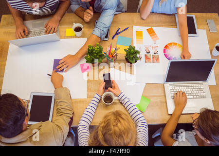 Creative colleagues with laptop and digital tablet Stock Photo