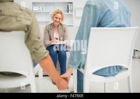 Psychologist helping a couple with relationship difficulties Stock Photo