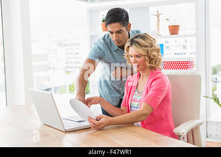 Concentrated colleagues using colour wheel Stock Photo