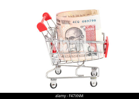 Indian 1000 rupees in shopping cart isolated on white background Stock Photo