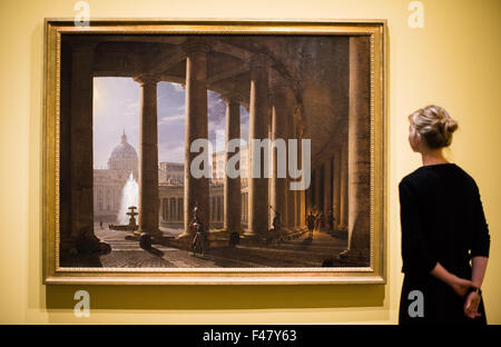 Hamburg, Germany. 15th Oct, 2015. A woman looks at a painting entitled 'Die Kolonnaden von Sankt Peter in Rom im Mondschein' (The Saint Peter Colonnades in Rome in the moonlight) by German painter Franz Ludwig Catel during a press event for the exhibition 'Franz Ludwig Catel - Images of Italy in the Romantic' at Kunsthalle in Hamburg, Germany, 15 October 2015. The exhibition features some 200 paintings, watercolours, drawings and prints created by Catel in Italy. Photo: DANIEL BOCKWOLDT/dpa/Alamy Live News Stock Photo