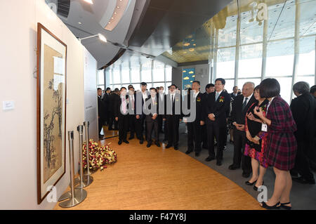 Hong Kong, China. 15th Oct, 2015. People view artworks during a painting and calligraphy exhibition in Hong Kong, south China, Oct. 15, 2015. The three-day exhibition, displaying hundreds of classical artworks from famous artists in modern and contemporary age, opened here Thursday. © Lui Siu Wai/Xinhua/Alamy Live News Stock Photo