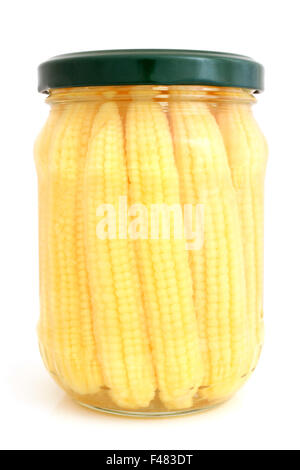 Preserved mini corn ears in glass jar Stock Photo