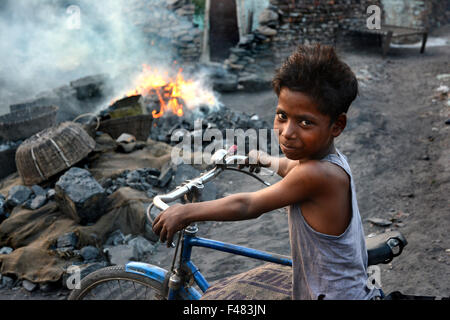 I am a boss - The laborer and their family lives in the adjacent area and spend their daily life.  They do not have good ameniti Stock Photo