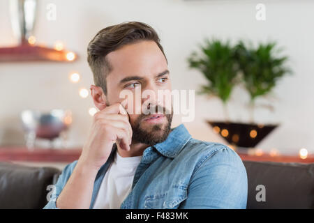 Sitting handsome man looking away Stock Photo