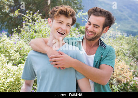 Happy homosexual couple hugging and laughing Stock Photo