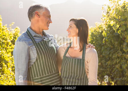 Happy vintners smiling and looking at each other Stock Photo