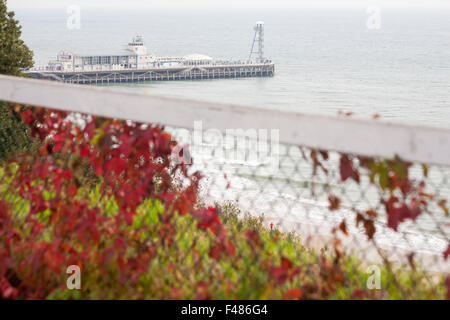 looking down over Bournemouth pier and beach in Autumn with colourful Virginia Creeper leaves in October Stock Photo