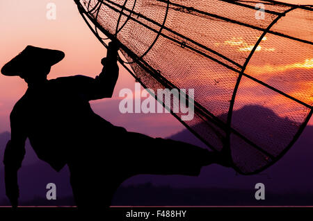 Inle Lake Fisherman is fishing in the last fish for the day Stock Photo