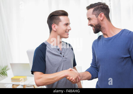 Happy casual businessman shaking hand Stock Photo