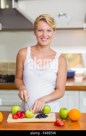 Pregnant woman preparing a fruit juice Stock Photo