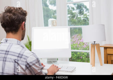 Handsome man working on computer Stock Photo