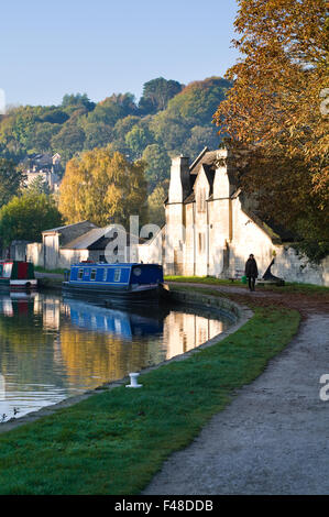 View looking along the Kennet and Avon canal towards St Matthews church on an autumn morning in Bath, Somerset, England. Stock Photo