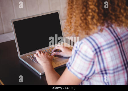 A woman using her laptop Stock Photo