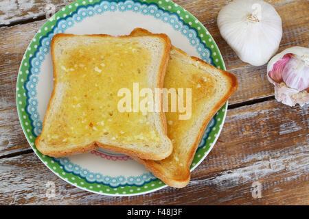 Two toasted slices with garlic bread Stock Photo