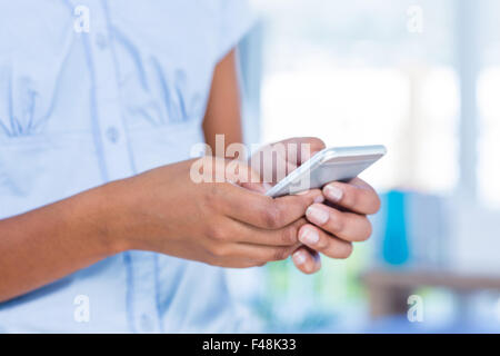 Businesswoman using her smartphone Stock Photo