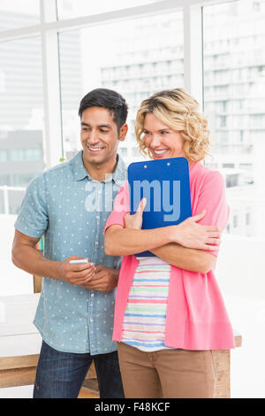 Smiling colleagues standing Stock Photo