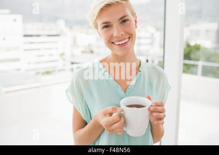 Pretty businesswoman looking at the camera Stock Photo