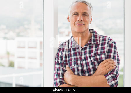 Smiling businessman looking at camera Stock Photo