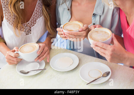 Happy friends having coffee together Stock Photo