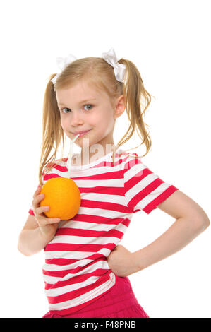 Girl drinking orange juice through straw Stock Photo