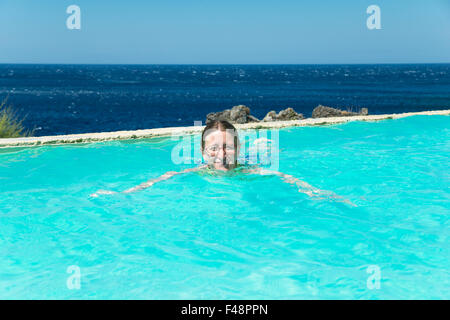 Woman swimming in a swimming pool, Kalypso Cretan Village Hotel, Karavos, Plakias,  Rethymno regional unit, Crete, Greece Stock Photo