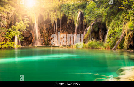 Waterfall with sun at Plitvice Lakes National Park, Croatia Stock Photo