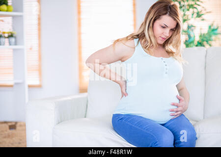 Pregnant woman getting a contraction Stock Photo