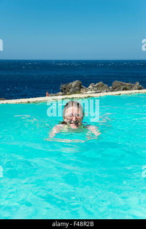 Woman swimming in a swimming pool, Kalypso Cretan Village Hotel, Karavos, Plakias,  Rethymno regional unit, Crete, Greece Stock Photo