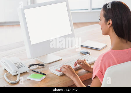 Creative businesswoman working on computer Stock Photo