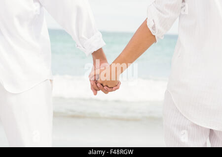 Couple walking hand in hand Stock Photo