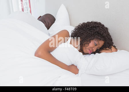 Dispute between a couple in bed together Stock Photo