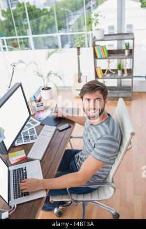 Designer using graphics tablet in the office Stock Photo - Alamy