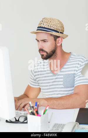 Serious handsome man using computer Stock Photo