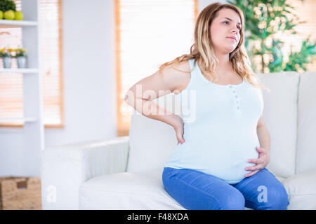 Pregnant woman getting a contraction Stock Photo