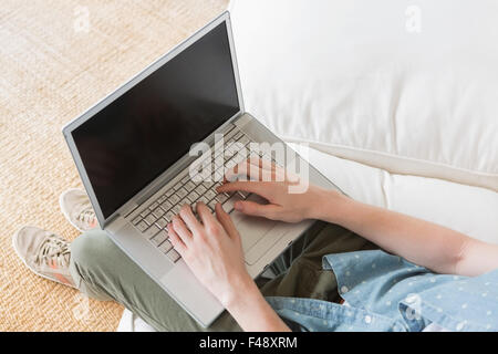 Close up of man typing on his laptop Stock Photo